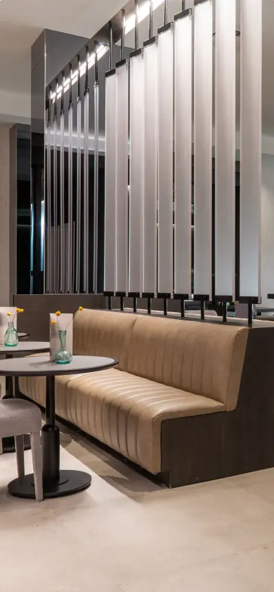 Modern lounge seating area with upholstered booth seating and contemporary interior design at Burlington Square