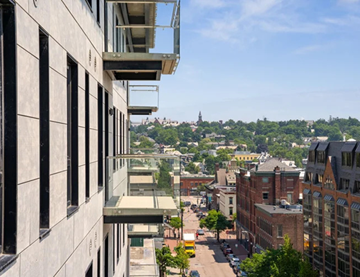 Downtown Burlington city view from Burlington Square Apartments featuring modern balconies and urban streetscape
